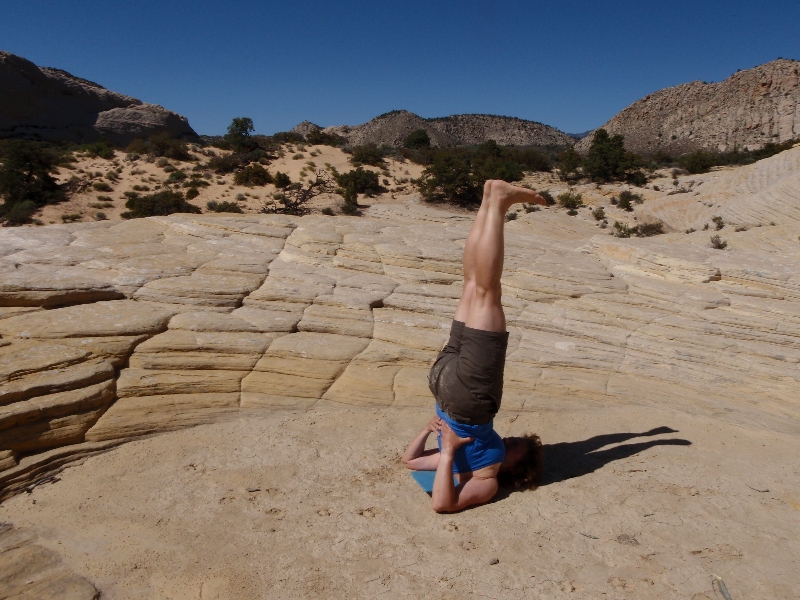 Jenny in Shoulderstand (Sarvangasana) in Snow Canyon State Park, Utah (Photo by Ian Hatter).